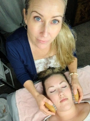 NHPC reflexologist Aimee Sebastian with client