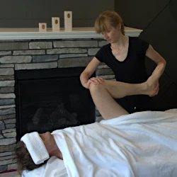 Michele Somer performing massage in a client's home