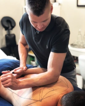 NHPC practitioner performing massage on client