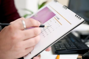 A person using a calendar