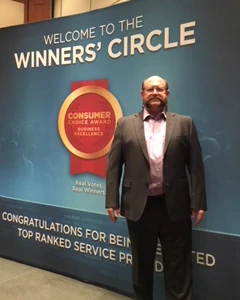 NHPC Board President Pete Swayles after winning a Consumer Choice Award. 