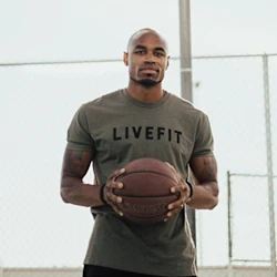 NHPC member Trevor Jordan holding a basketball.