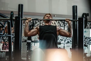 A weight lifter working out in a gym